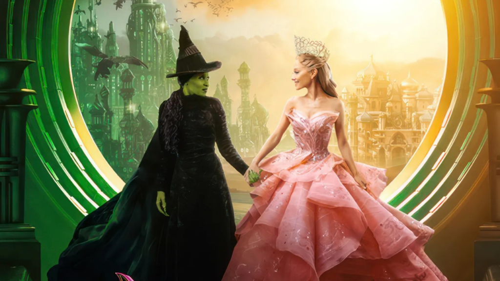 Elphaba and Glinda from Wicked: Part One hold hands against the backdrop of the Emerald City